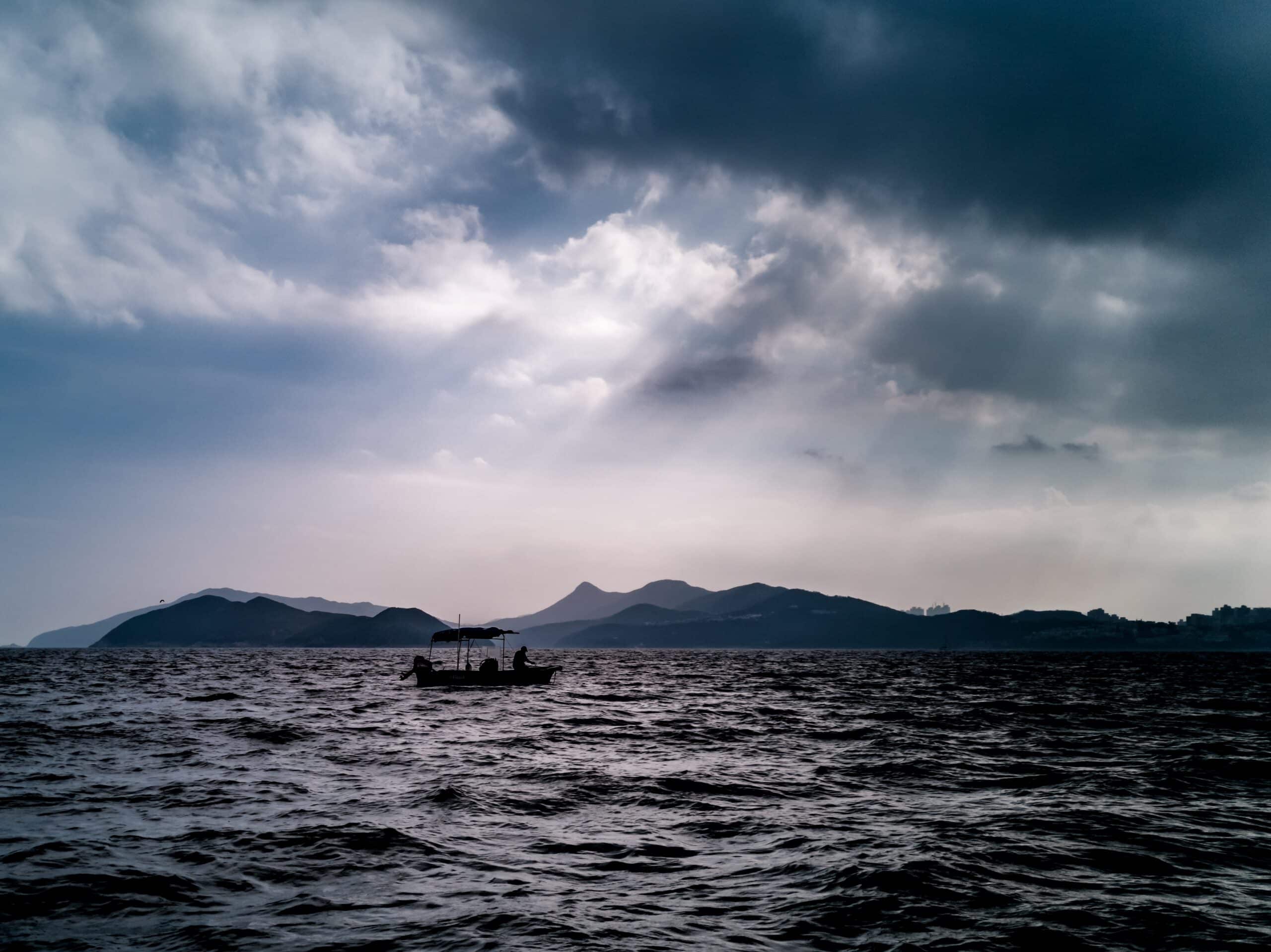 Man on a boat | Photo by Wai Siew on Unsplash