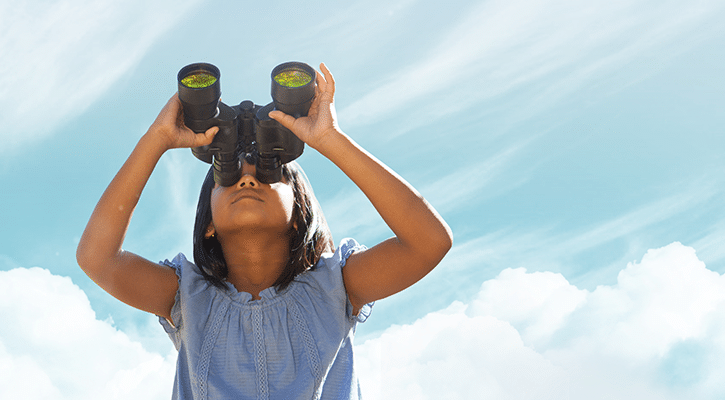 Girl looking into the sky