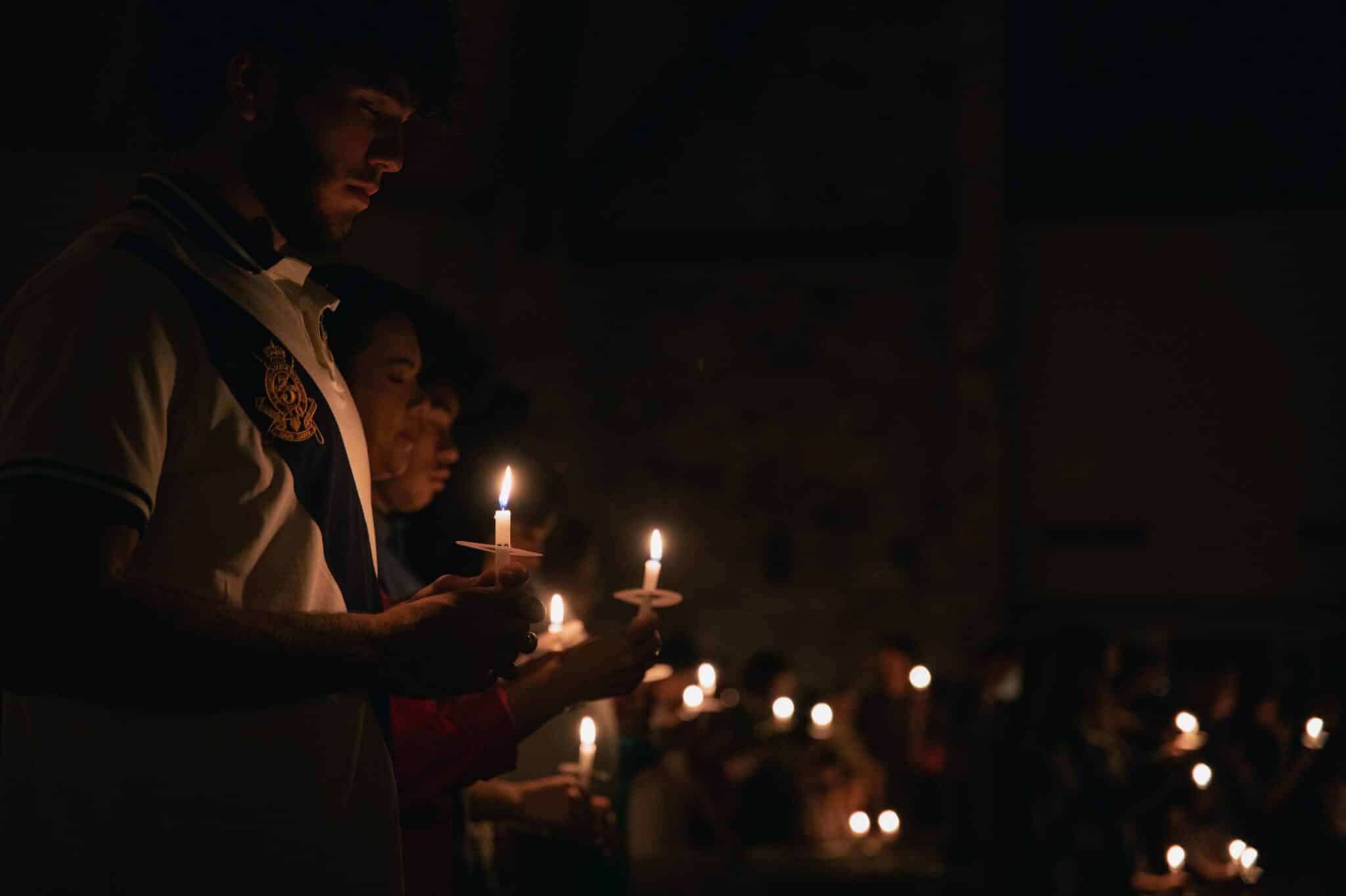 People holding candles | Photo by Zach Lucero on Unsplash