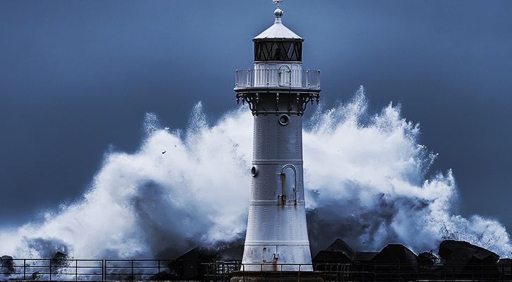Lighthouse surrounded by waves