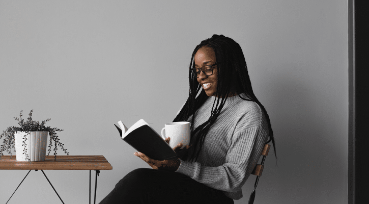 Woman sitting reading book