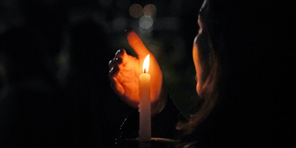 woman holding candle