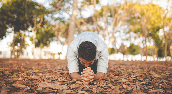 man kneeling on floor