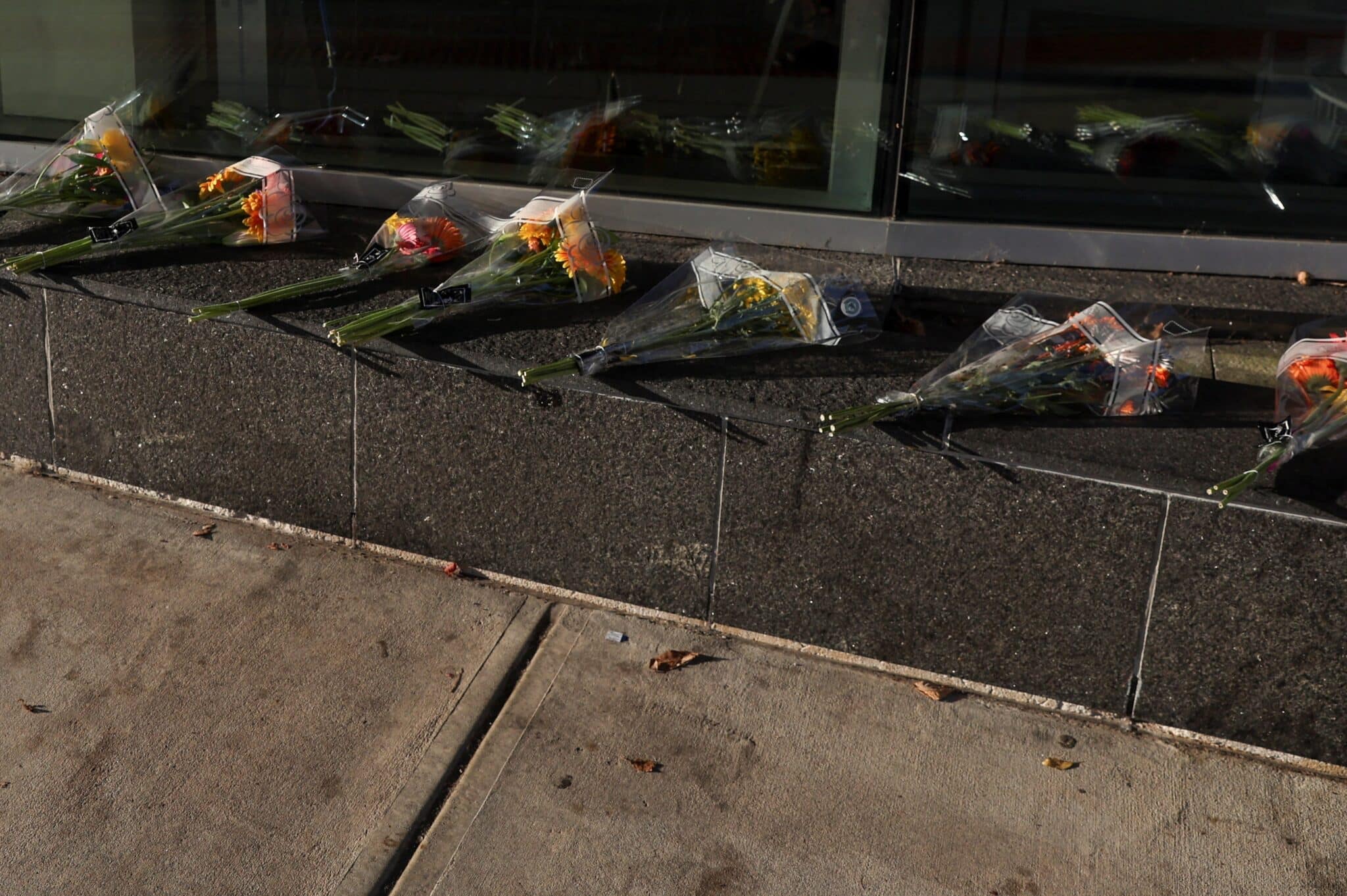 Flowers lie outside a Central Maine Medical Center's emergency entrance, following Wednesday's mass shooting in Lewinston, Maine, October 28, 2023. (OSV News photo/Shannon Stapleton, Reuters)
