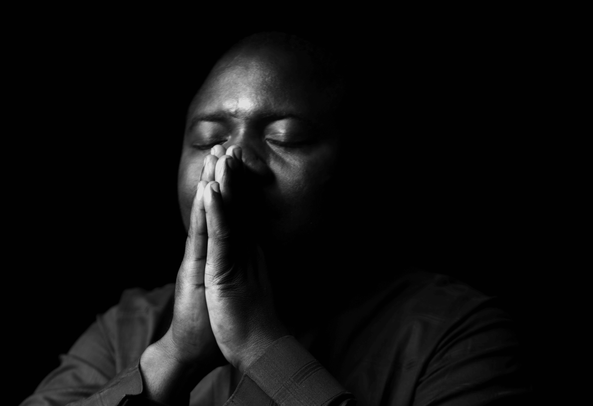 man praying | Photo by KTMD ENTERTAINMENT on Unsplash