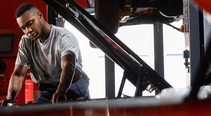 man working on car