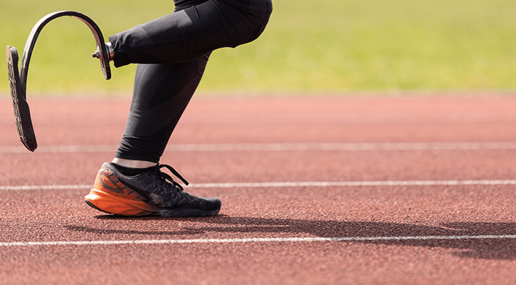 man with artificial leg running