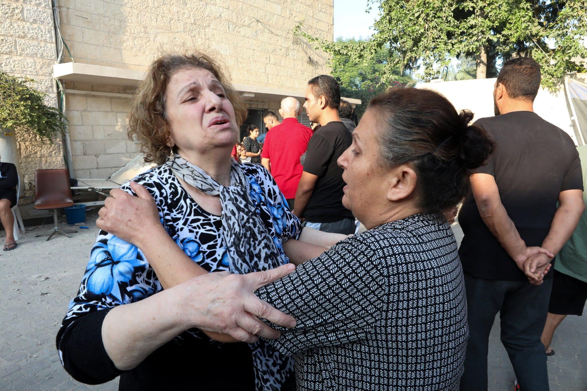 Women react outside St. Porphyrios Greek Orthodox Church in Gaza Oct. 20, 2023, after an explosion went off the night before. Several hundred people had been sheltering at the church complex, many of them sleeping, at the time of the explosion. The Hamas Ministry of Interior in Gaza blamed the explosion on an Israeli airstrike but responsibility for it had not yet been independently verified. (OSV News photo/Mohammed Al-Masri, Reuters)