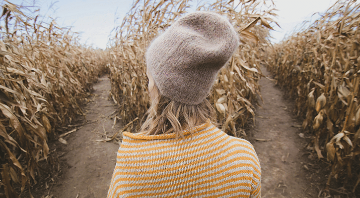 woman standing before two paths.