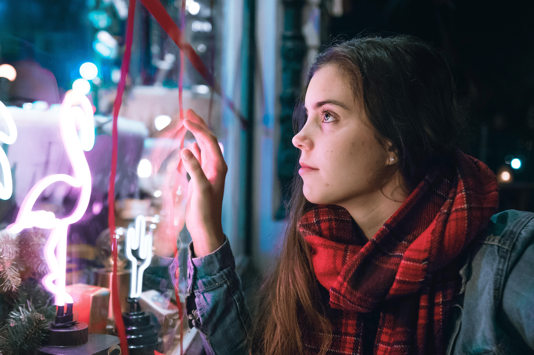 woman looking into shop window