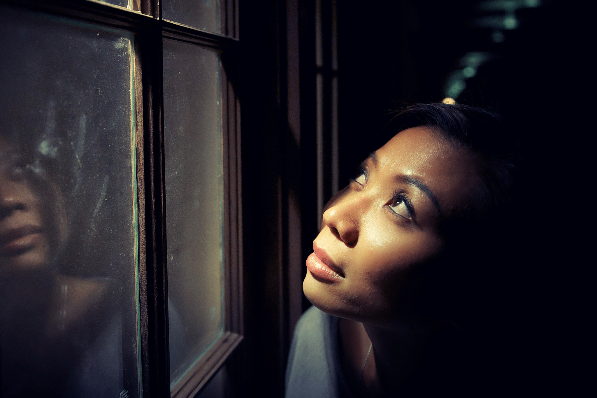 woman looking out the window.