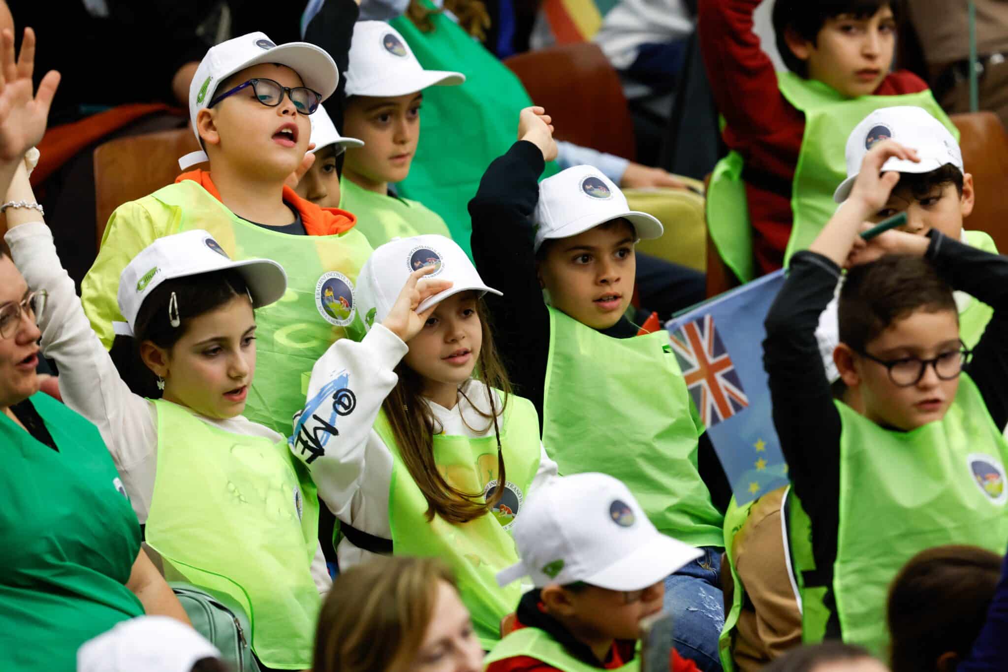 Young people cheer for Pope Francis during the international meeting "Let Us Learn from Boys and Girls" in the Paul VI hall at the Vatican Nov. 6, 2023. (CNS photo/Lola Gomez)