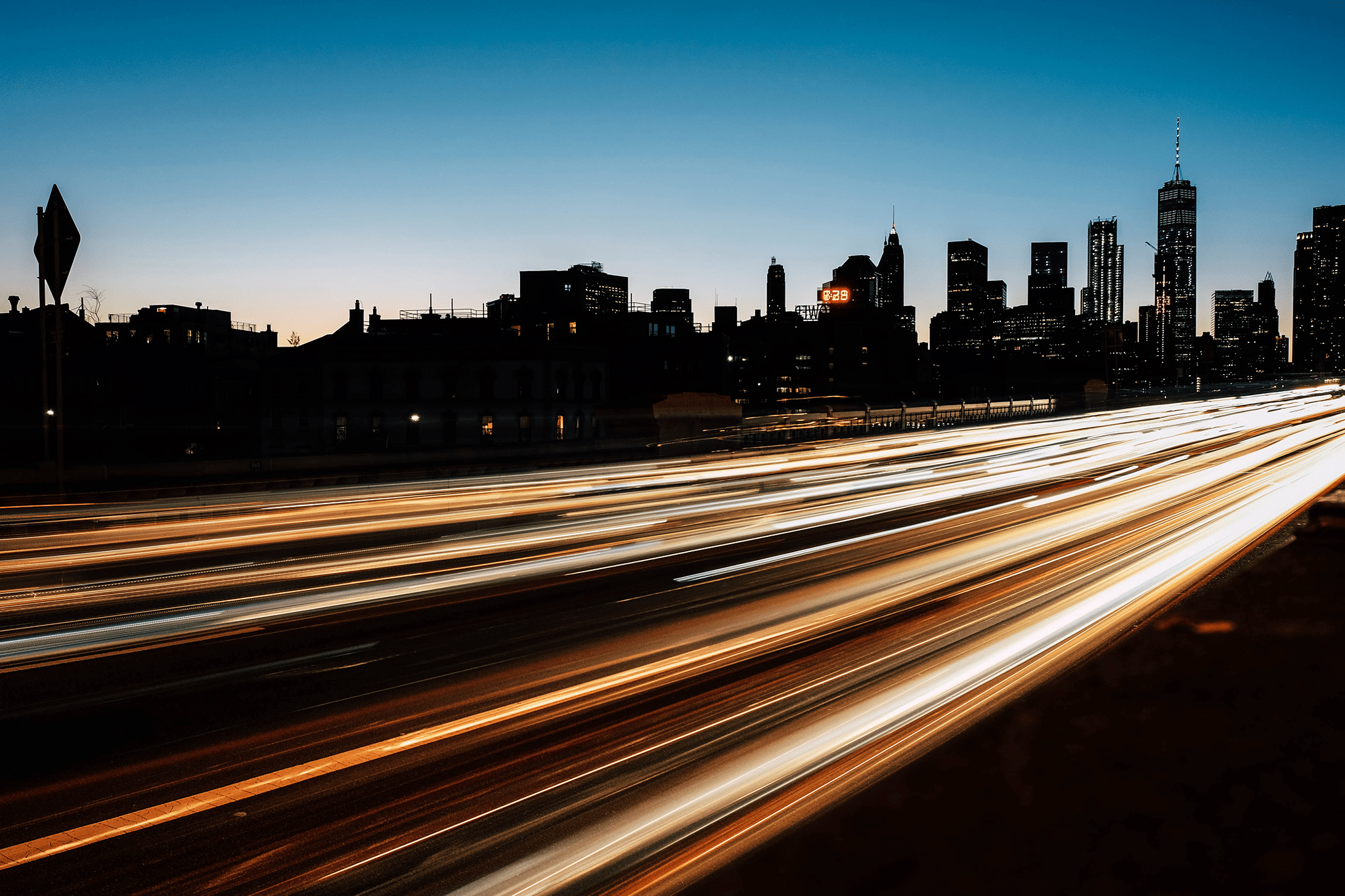 City at night with lights from cars.