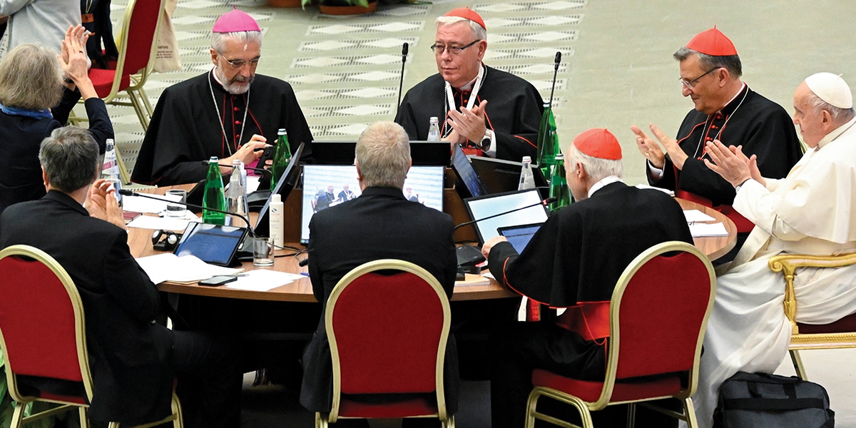 Pope sitting at round table at Synod