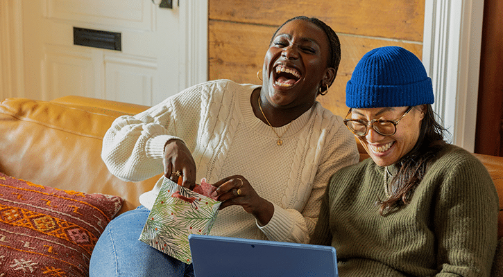 two woman laughing together