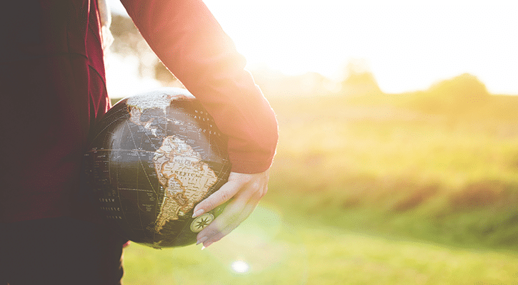 person holding globe