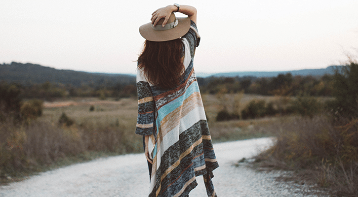 woman walking along a hidden path.