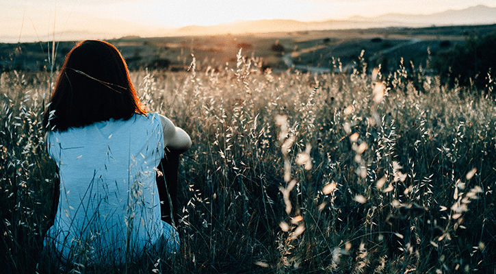 woman lonely in a field.