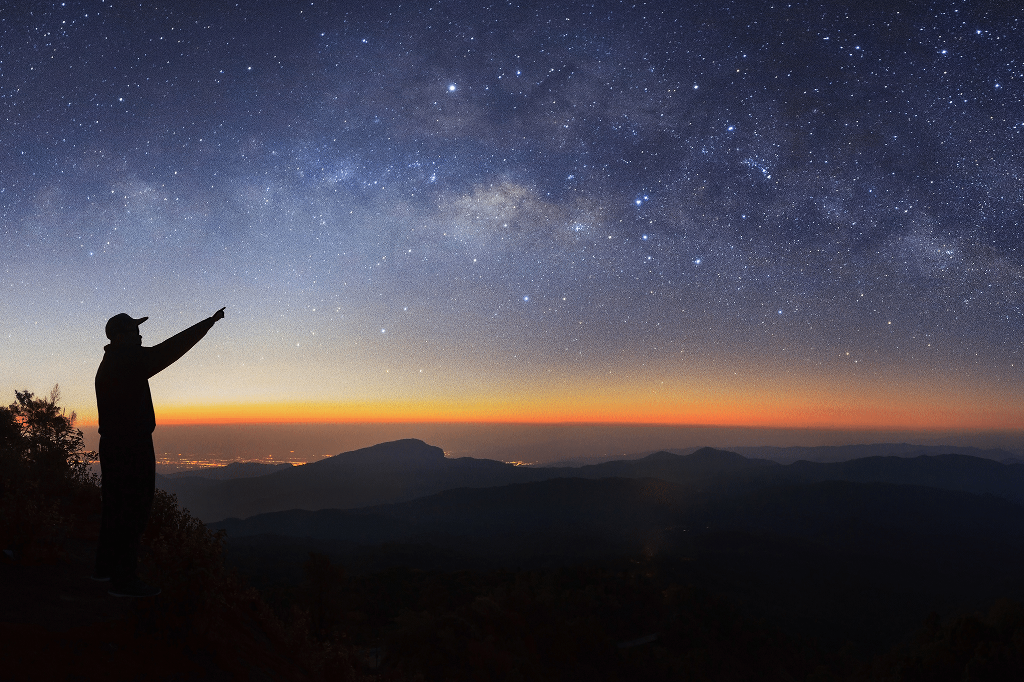 men pointing to the stars