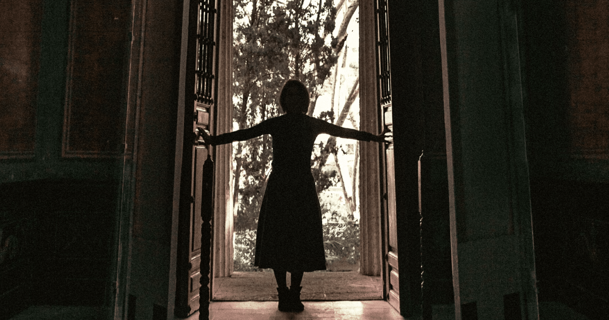 Woman opens a door | Photo by Jr Korpa on Unsplash