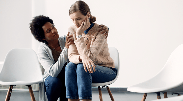 woman showing compassion to another woman