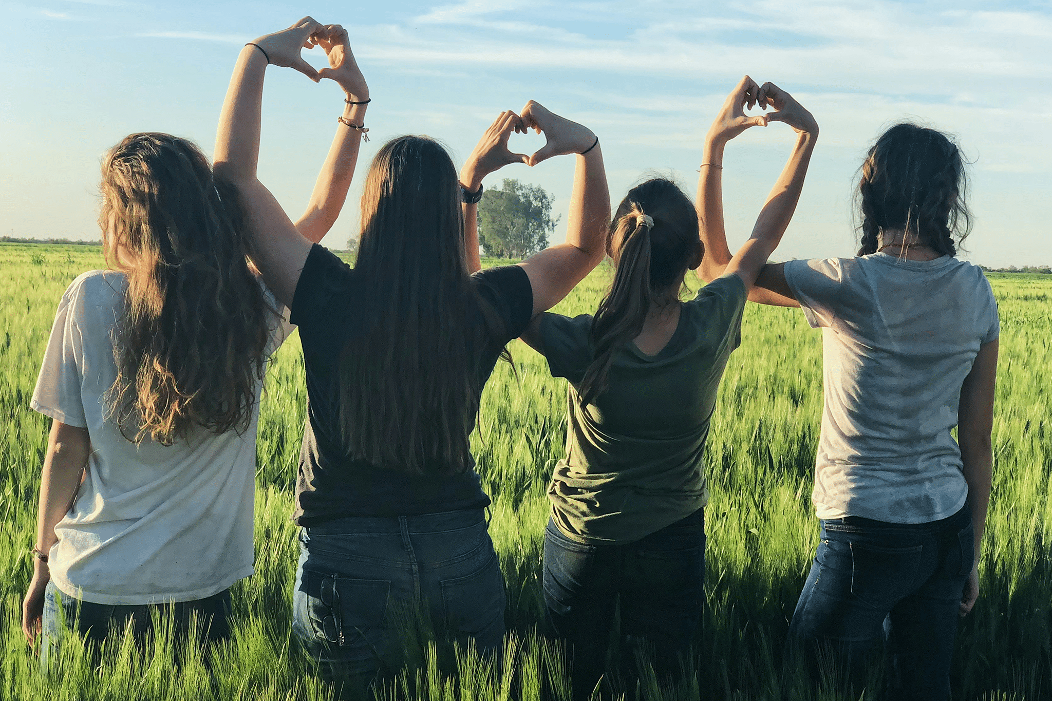 group of girls holding hands