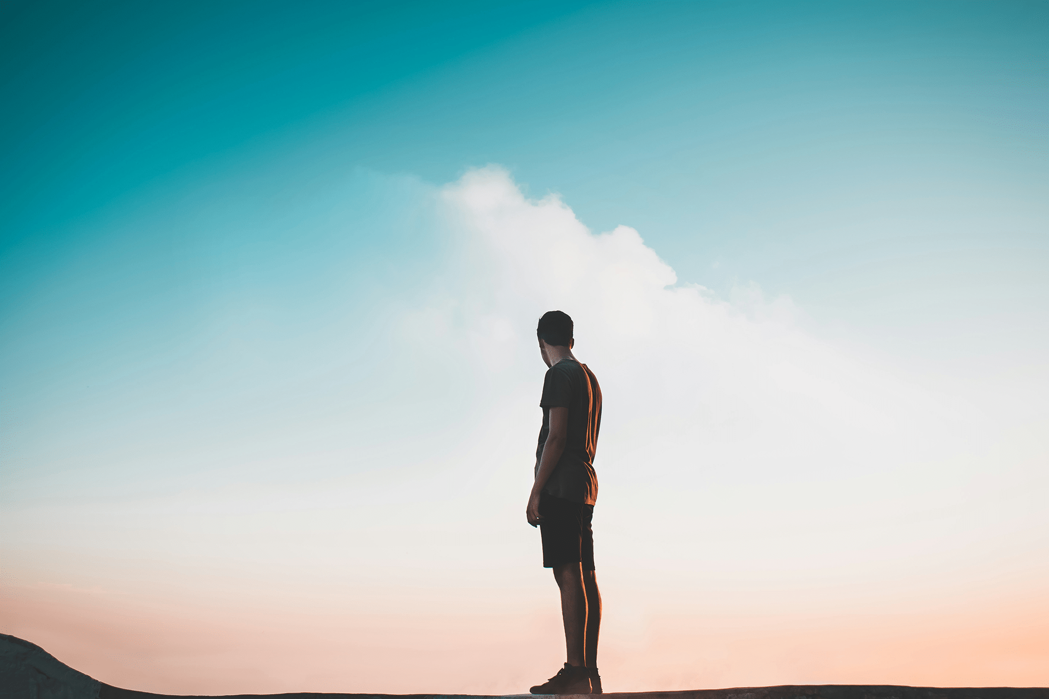 man standing on earth looking into heaven