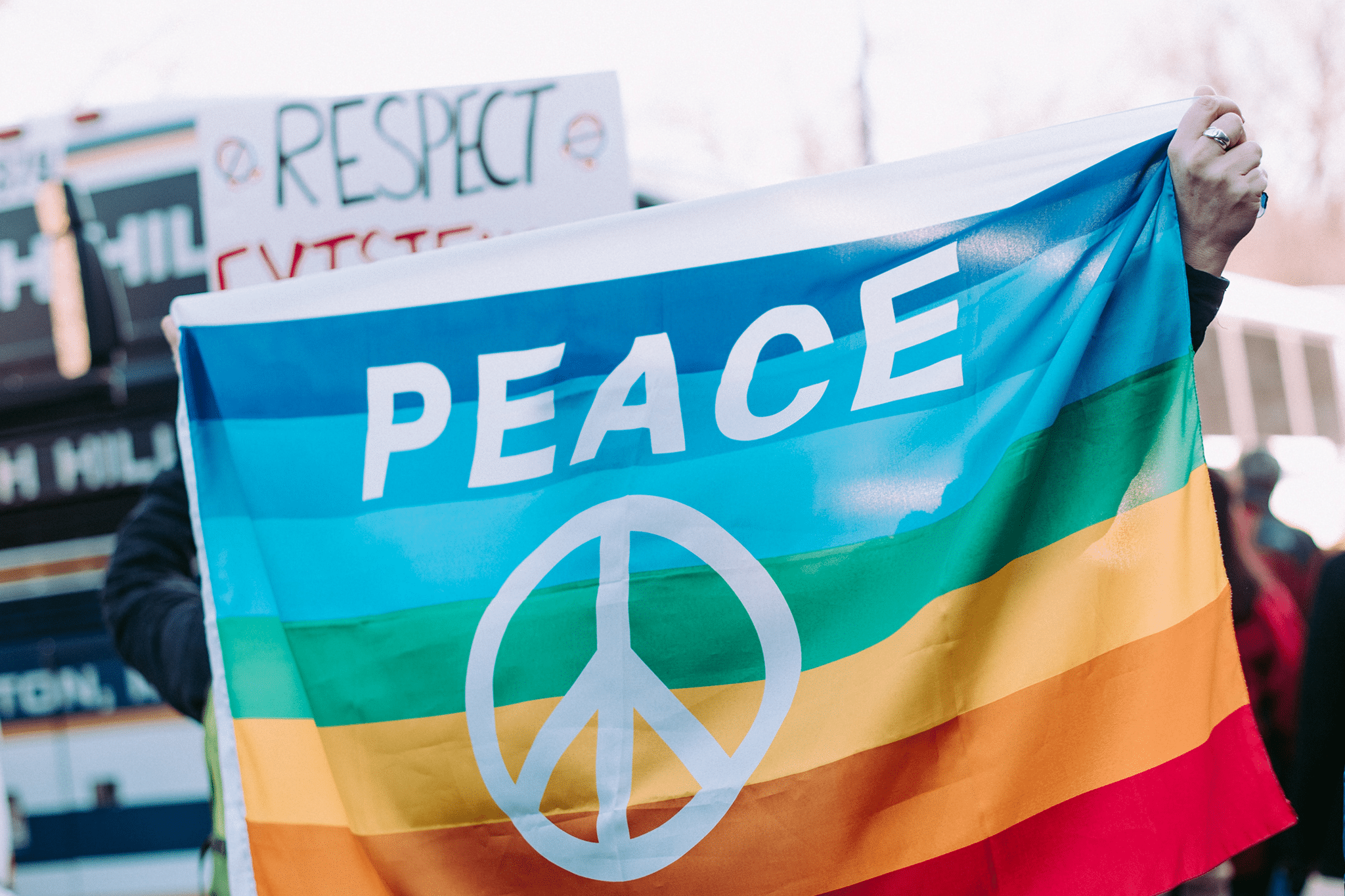 person holding peace flag