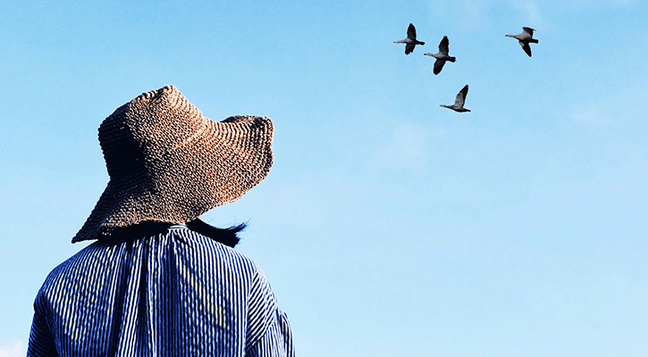 woman starring into the sky