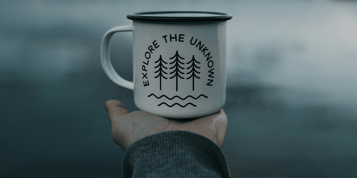 mug with the words "explore the unknown"