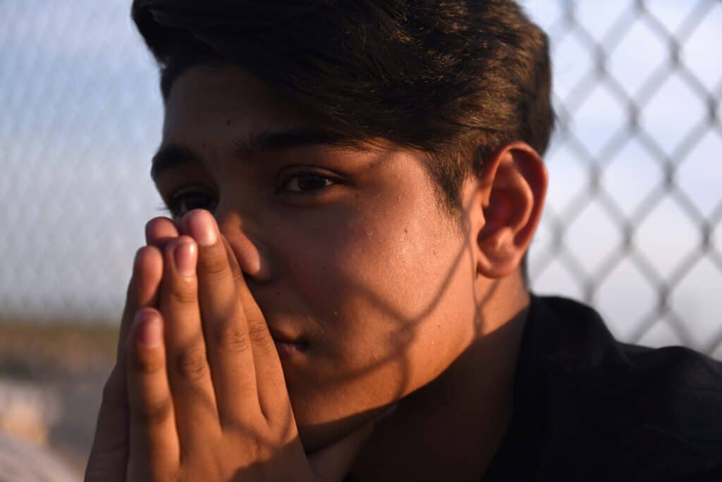 Horizon High School student Yaret Villa prays during a vigil Aug. 5, 2019, in honor of classmate Javier Rodriguez, who was killed while shopping at a Walmart in El Paso, Texas. (CNS photo/Callaghan O'Hare, Reuters) 