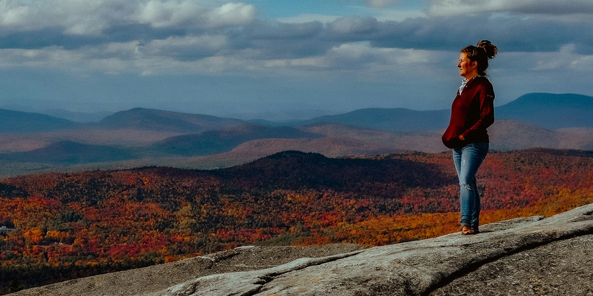 woman looking into a valley