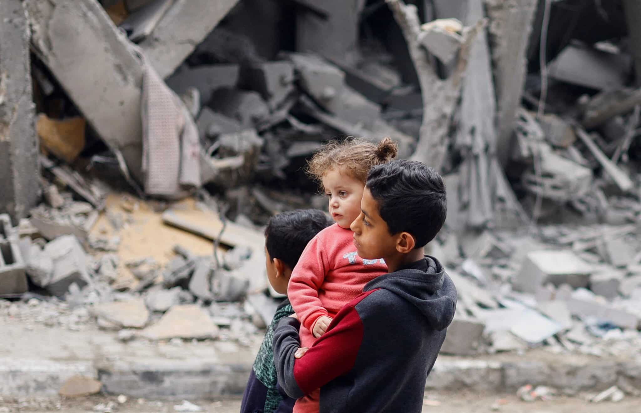 Palestinian children react near the site of an Israeli airstrike, amid the ongoing conflict between Israel and the Palestinian Islamist group Hamas, in Rafah, in the southern Gaza Strip, March 24, 2024. (OSV News photo/Mohammed Salem, Reuters)