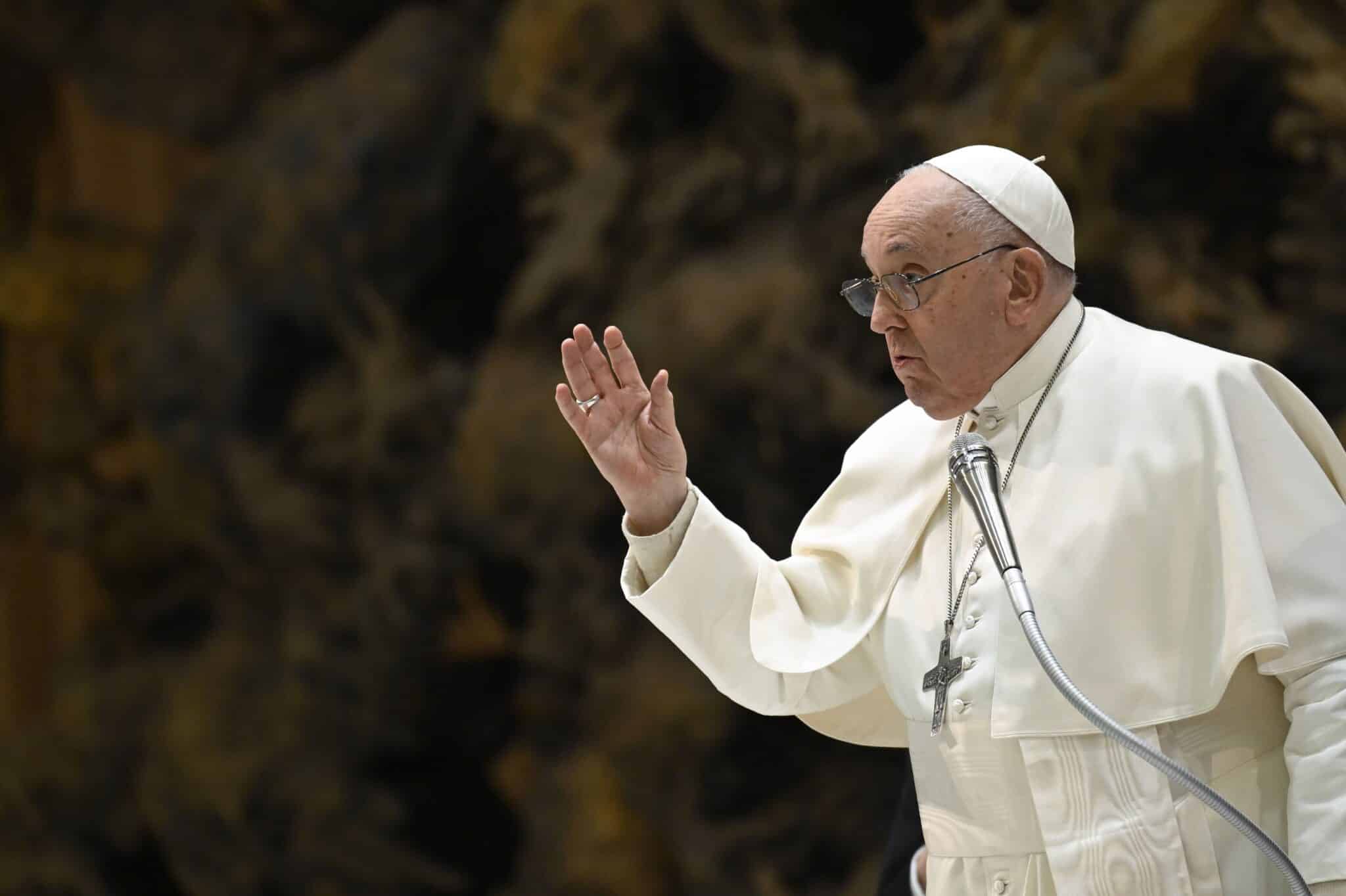 Pope Francis blesses visitors at the end of his weekly general audience in the Vatican's Paul VI Audience Hall Jan. 17, 2024. (CNS photo/Vatican Media)