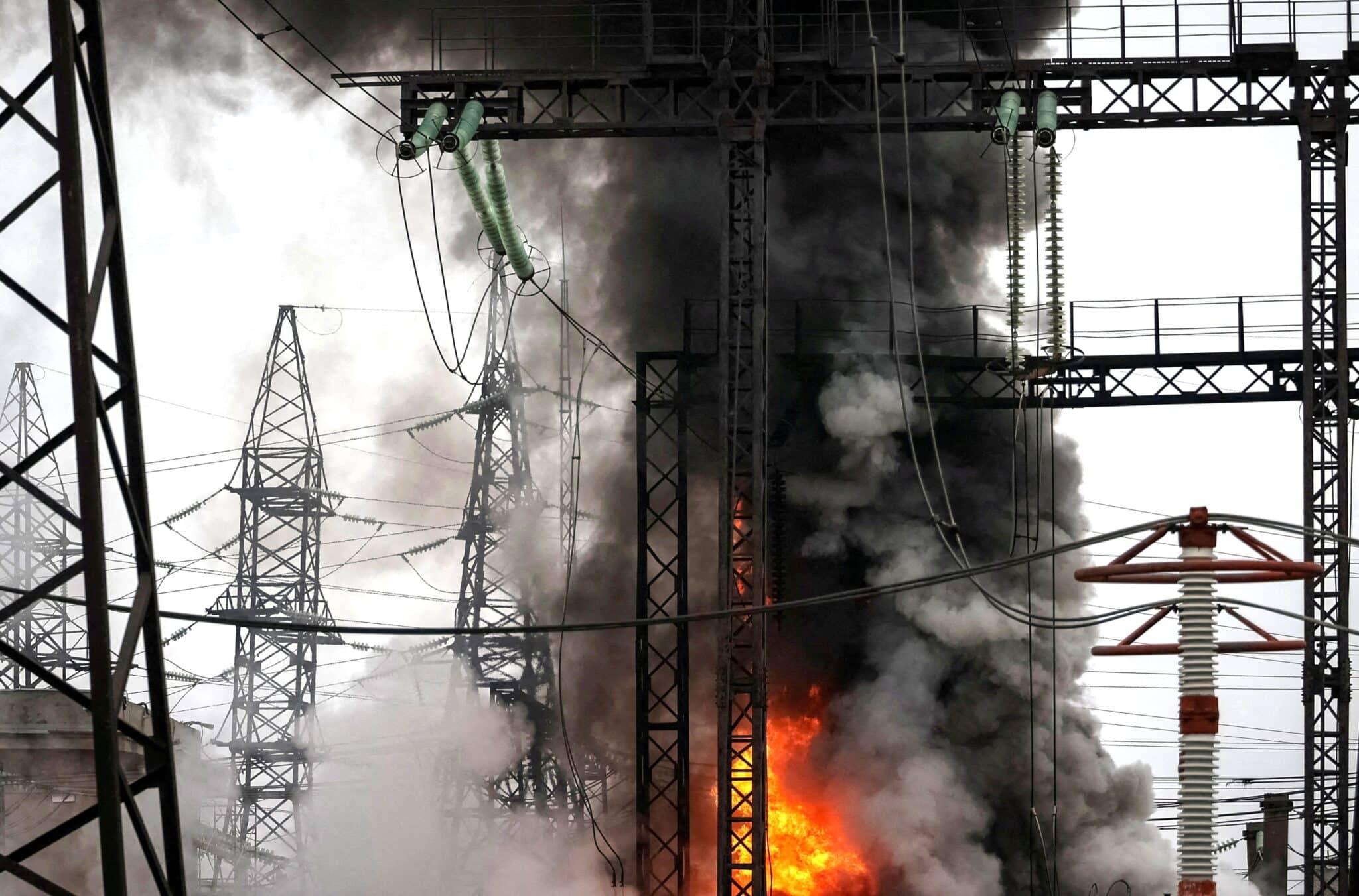 Smoke and flames are seen near a high-voltage line at a site of a Russian airstrike, outside Kharkiv, Ukraine, March 22, 2024. Fifteen U.S.-based religious leaders, including Archbishop Timothy P. Broglio and Metropolitan Archbishop Borys A. Gudziak, have condemned Russia's March 21-22 attacks on Ukraine's energy grid as "war crimes." (OSV News photo/Sofiia Gatilova, Reuters)