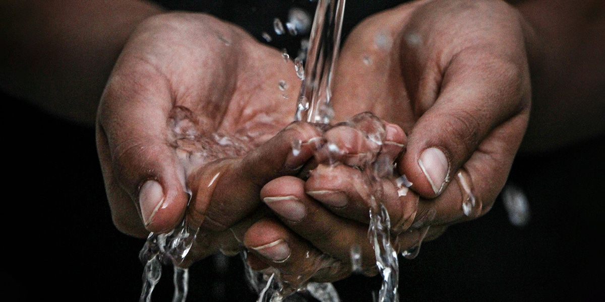 hands holding water