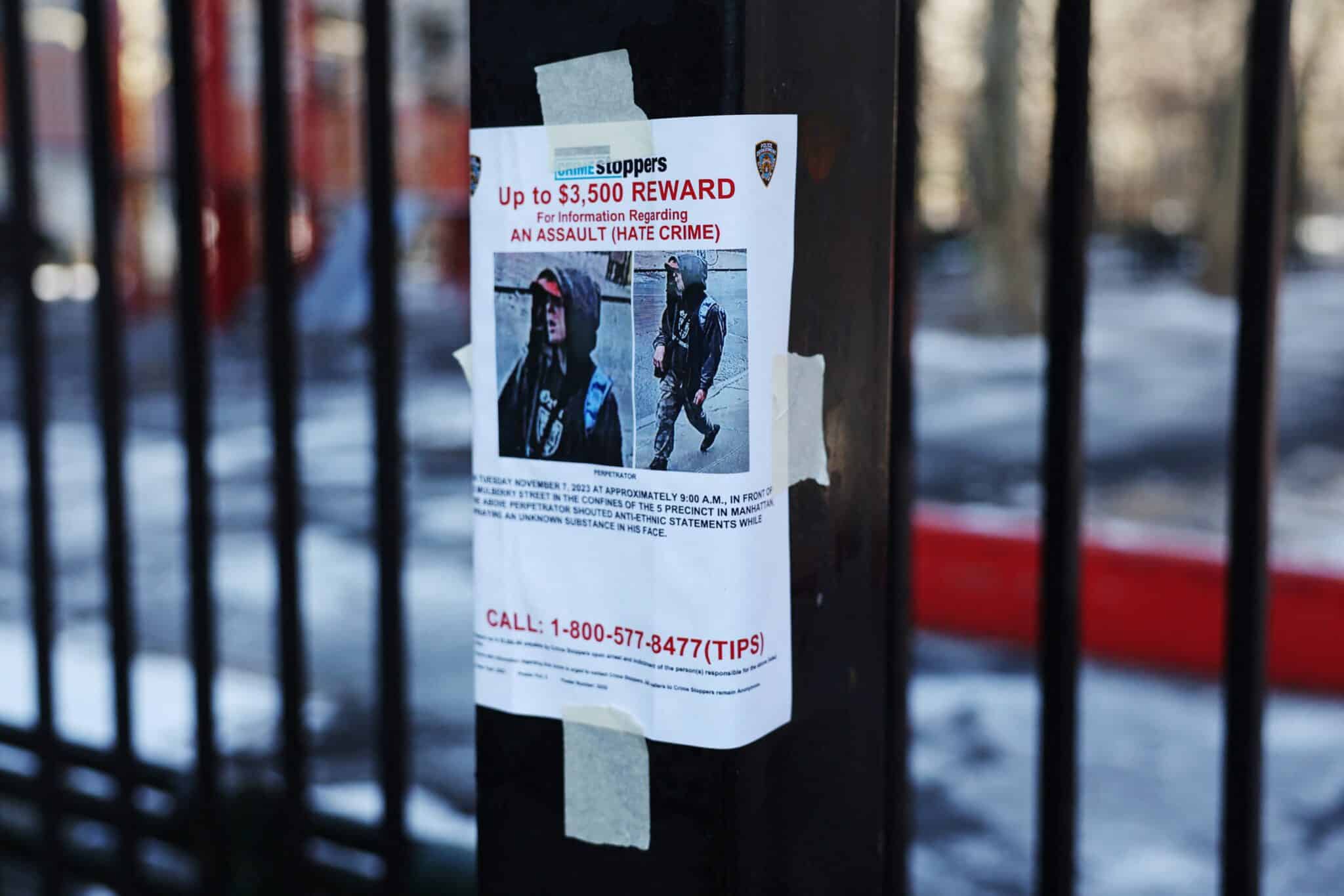 reward-poster-hanging-on-a-fence-with-picture-of-man-wanted-for-hate-crime