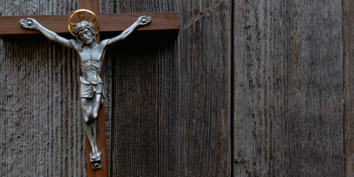 A crucifix with Jesus hanging on a wall