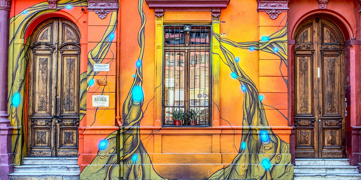 outside walls painted with trees surrounding doors