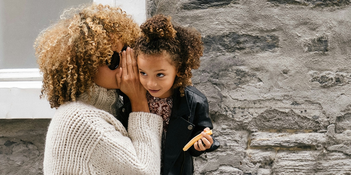 woman speaking gently to her child.