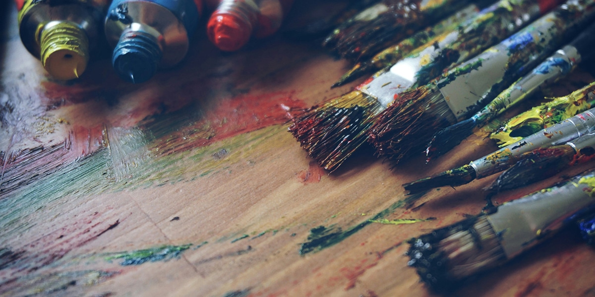 paint, paint brushes, different colors and art