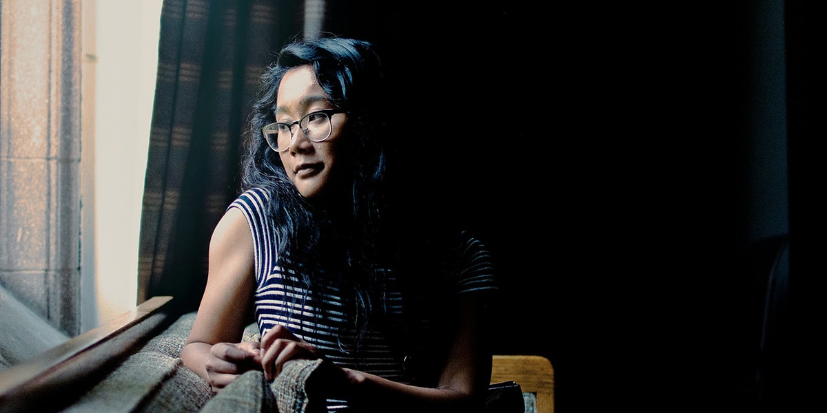 woman sitting quietly, reflecting