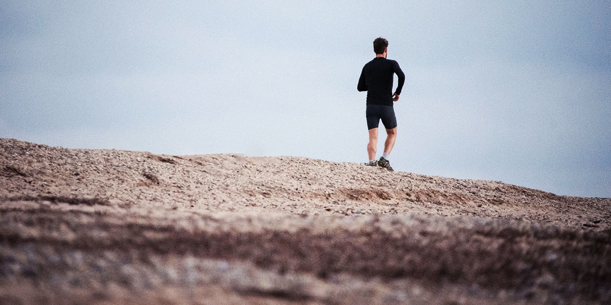 man on a journey, walking along a road