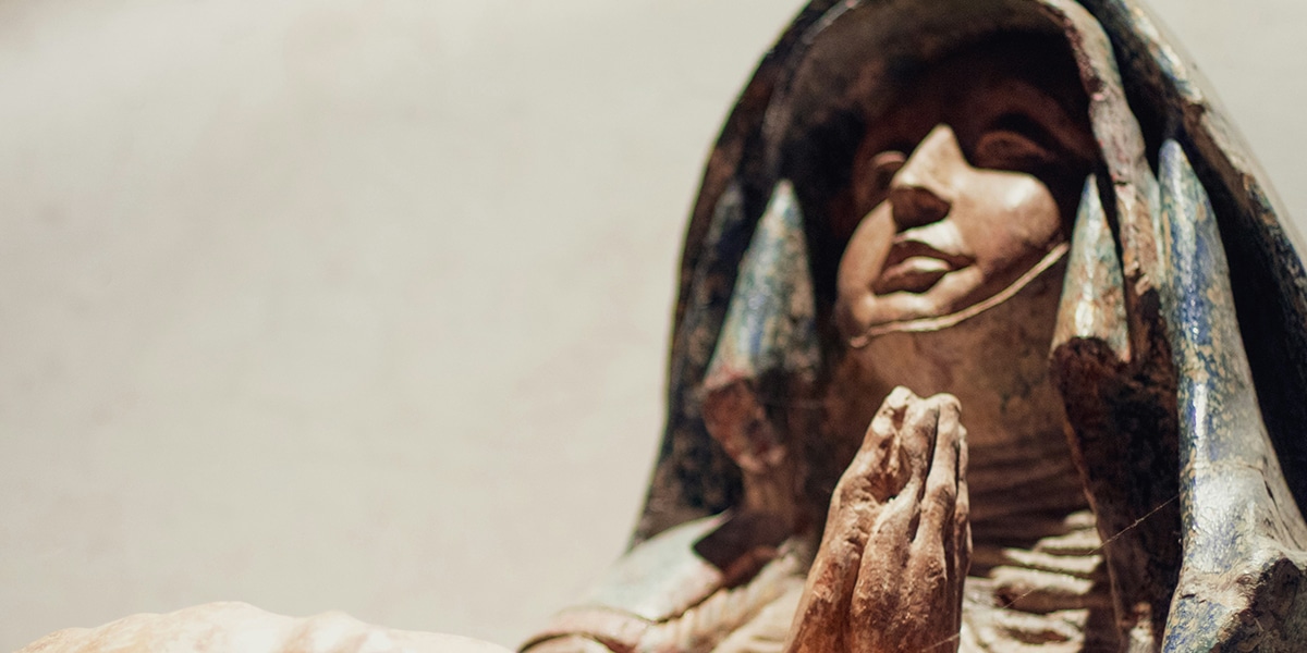 Mary praying with folded hands