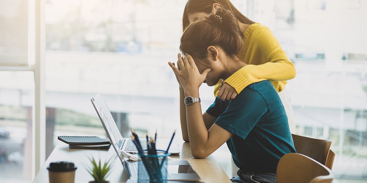 woman showing compassion to a upset woman