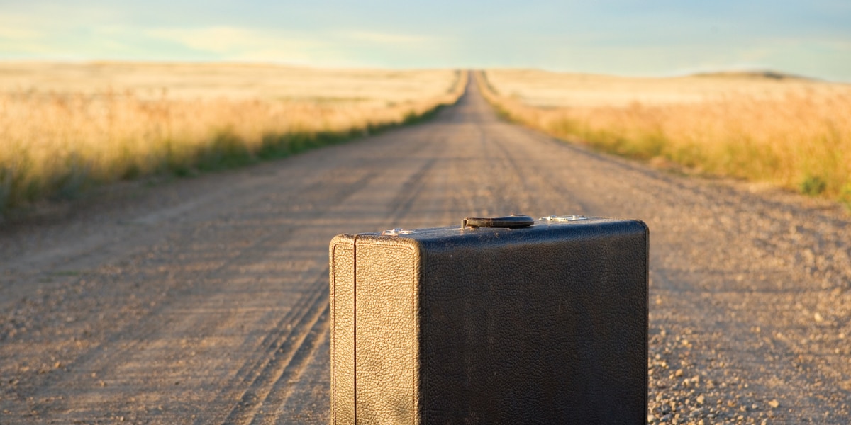 luggage on a dirt road