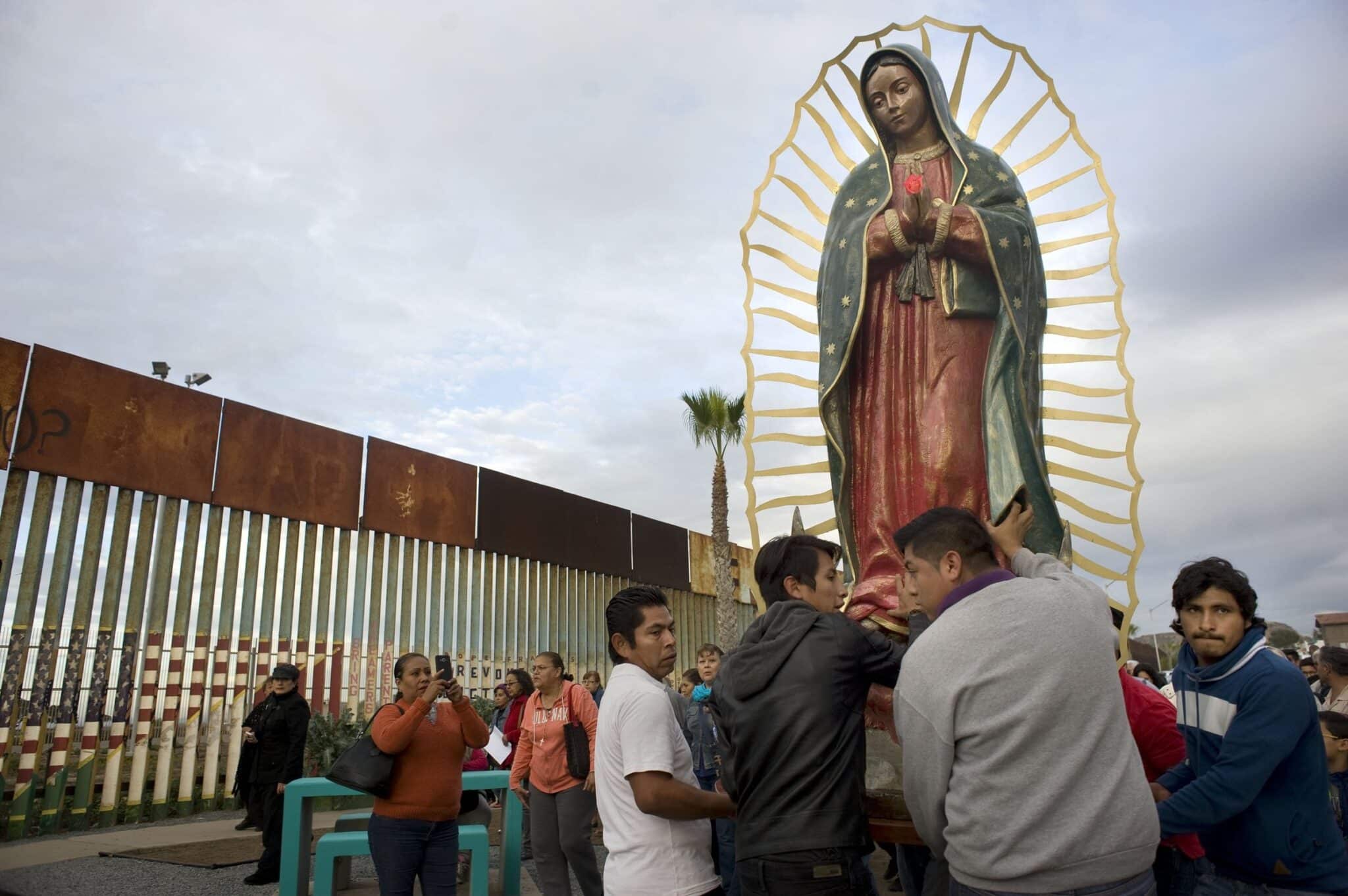 A file photo shows a statue of Our Lady of Guadalupe as it is unloaded from a truck after a procession to the U.S.-Mexico border fence in Tijuana, Mexico, where Mass was celebrated.
