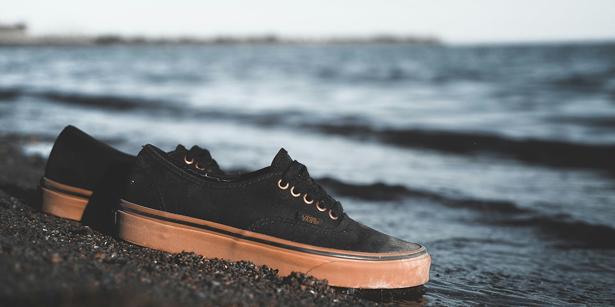 shoes left behind on a beach.