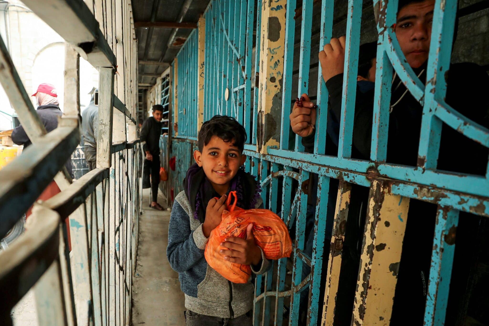 A Palestinian boy carries a plastic bag with bread Feb. 3, 2025, in Gaza City in Gaza Strip amid a ceasefire between Hamas and Israel. (OSV News photo/Dawoud Abu Alkas, Reuters)