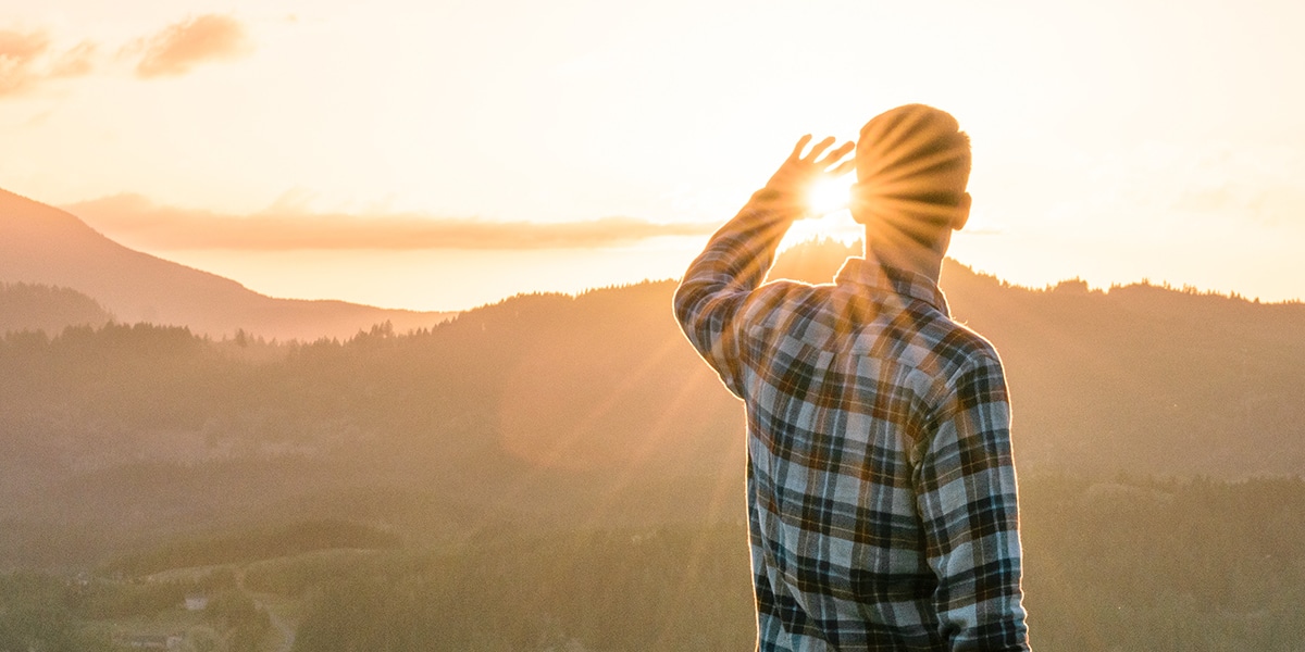 man watching a sunrise surrounded by Sundays